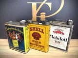 three tins that are sitting on a table
