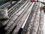 many rolls of paper that are laying on a table