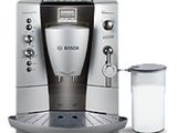 une image représentant une machine à café avec une tasse à côté