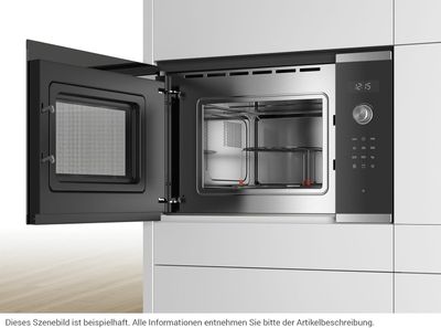 a black and silver oven with a door open