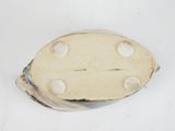 a small white object that is on a white surface