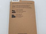 the back of a cardboard box with a sticker on it