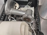 a basket full of hair dryers and other items on the counter