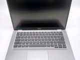 an open laptop computer sitting on top of a white table