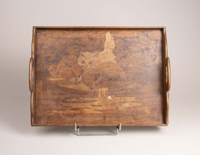 an old wooden tray with a picture of a castle on it