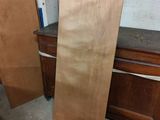 two pieces of plywood on the floor next to each other