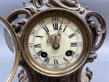 a clock that has roman numerals on the face of it