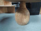 a wooden table with a wooden top on the floor