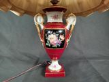 a lamp that is on a table with a lamp shade on it