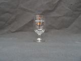 a wine glass that is sitting on a table