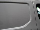 a white van that is parked in a parking lot