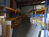 a large warehouse with shelves and boxes on it
