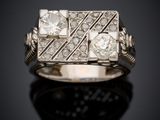 a close up of a diamond ring on a black surface