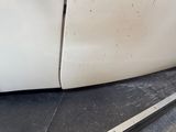 a close up of a car door with the door handle missing