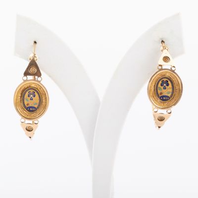 two pairs of earrings with gold and blue designs on them