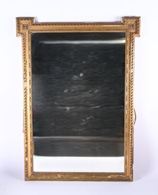 an image of a gold framed mirror sitting on top of a table