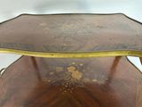a wooden table with a decorative design on top of it