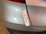 a close up of a car with a sticker on it ' s bumper