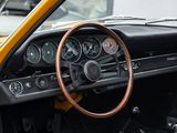 a dashboard and steering wheel of a yellow sports car