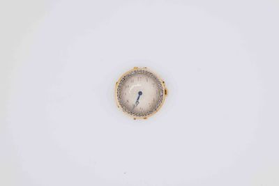 a clock that is on the side of a white wall