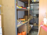 a room with a shelf and a chair in it
