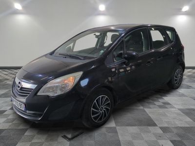 a picture of a black car parked in a garage