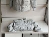 a picture of a white jacket on display in a store