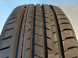 a close up of a tire on a sunny day with a blue sky in the background