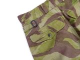 the pants are camouflaged and have a buckle on the side