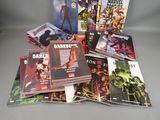 a pile of comics sitting on top of each other on a table