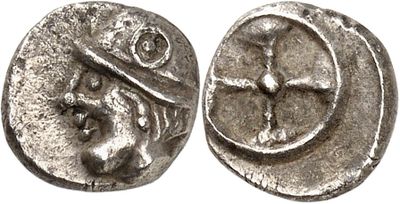 a silver coin with an image of a man on it