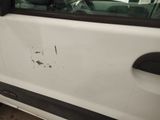a white van with a hole in the side of it