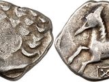 une pièce d'argent sur laquelle figure un cheval au recto et un cheval au verso