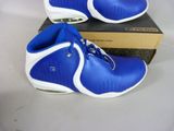 blue and white shoes with a box on a white surface