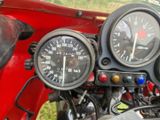 a close up of a motorcycle with a speedometer and gauges on it