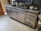 a stainless steel kitchen with a stove and a dishwasher