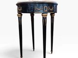 une table noire et dorée avec un plateau en marbre