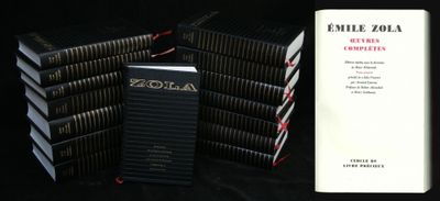 several books are stacked on top of each other on a table