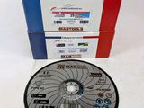 a close up of a disc sitting on top of a table next to a stack of boxes