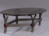 a glass table with metal legs and a glass top