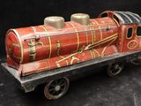 a toy train that is sitting on a black surface