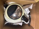 a box with a cup and a saucer inside of it
