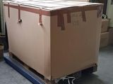 a large box sitting on a pallet in a warehouse