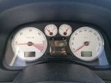 a close up of a speedometer and gauges in a car