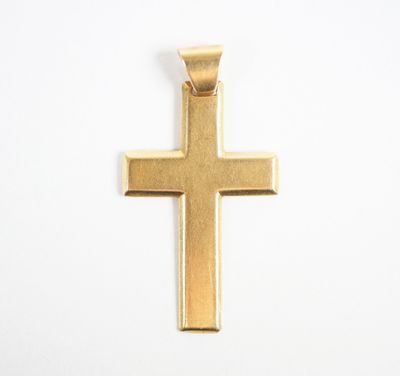 a gold cross pendant on a white background