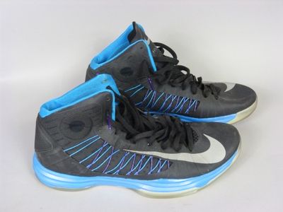 pair of black and blue sneakers on a white surface