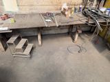a workbench in a garage with a lot of tools