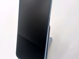 a cell phone that is sitting on top of a stand