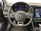 the interior of a car with a steering wheel and dashboard controls