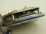 a close up of a watch that is being worked on